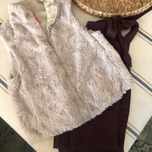 Faux fur vest and maroon pants